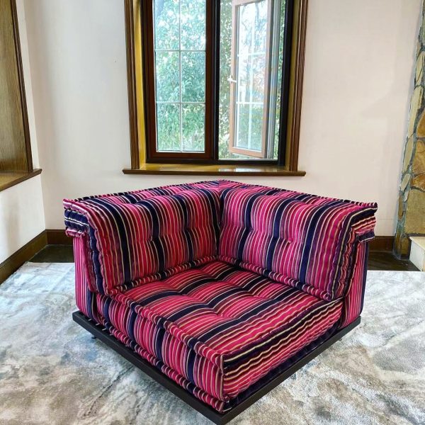 French Daybed Mah Jong Sofa, Corner Seater in vibrant red and pink striped fabric, displayed in a cozy room with a window view.