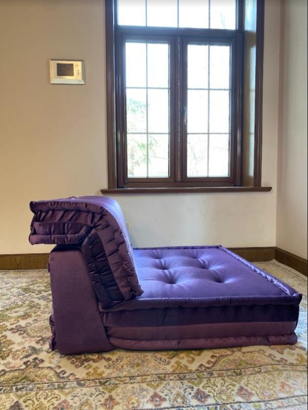 Side view of purple Mah Jong modular sofa with layered cushion backrest