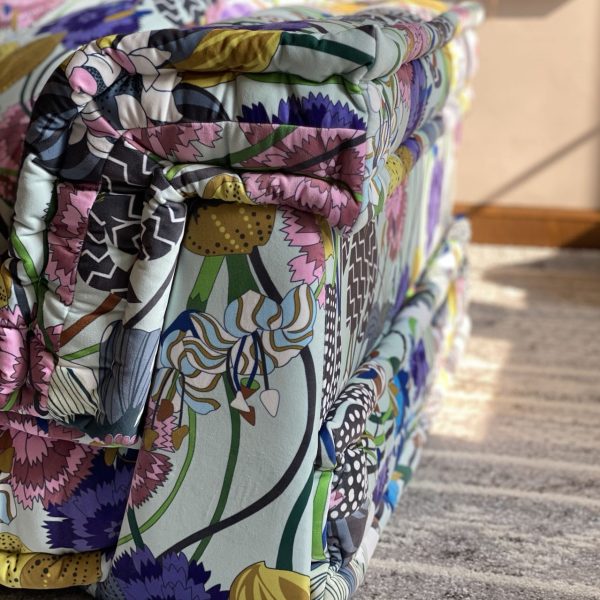 Close-up of French Daybed Mah Jong Sofa Corner Seater with intricate floral upholstery in purple, pink, and yellow tones.