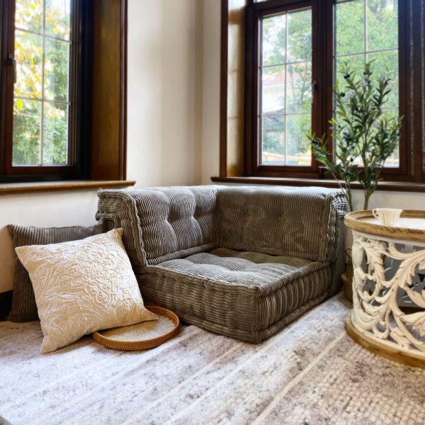 French Daybed Mah Jong Sofa Corner Seater in textured grey fabric, accompanied by decorative pillows and a boho-style side table.