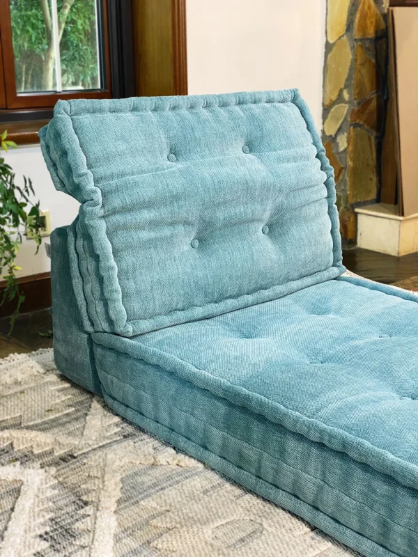 Close-up of Mah Jong Daybed Sofa highlighting its thick cushions and elegant teal fabric.