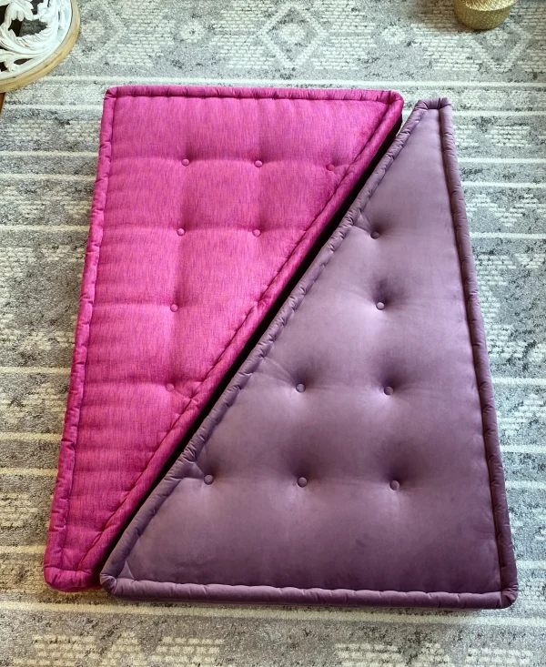 French Daybed Mah Jong Sofa with purple and pink triangular cushions layered together for a geometric design.