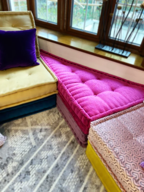 French Daybed Mah Jong Sofa featuring a pink triangular cushion, part of a modular seating arrangement.