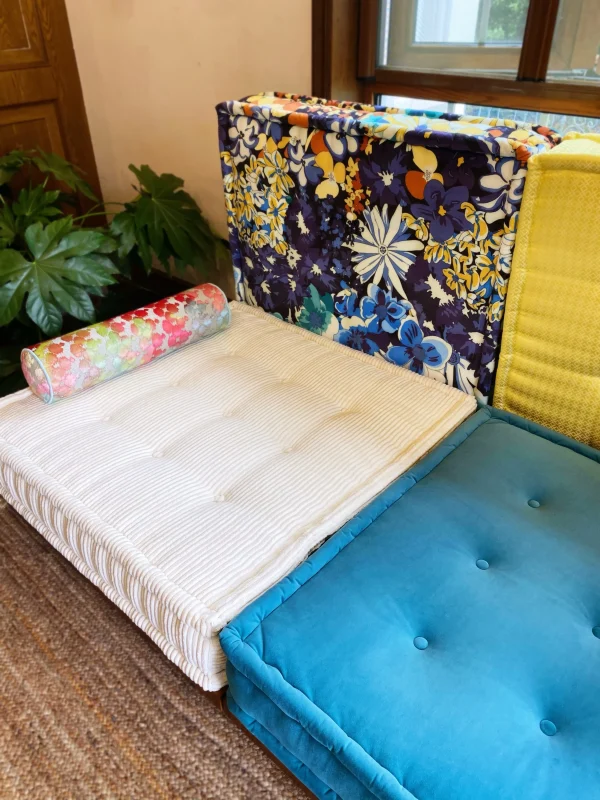 French Daybed Mah Jong Sofa with blue and white cushions on a wooden frame.