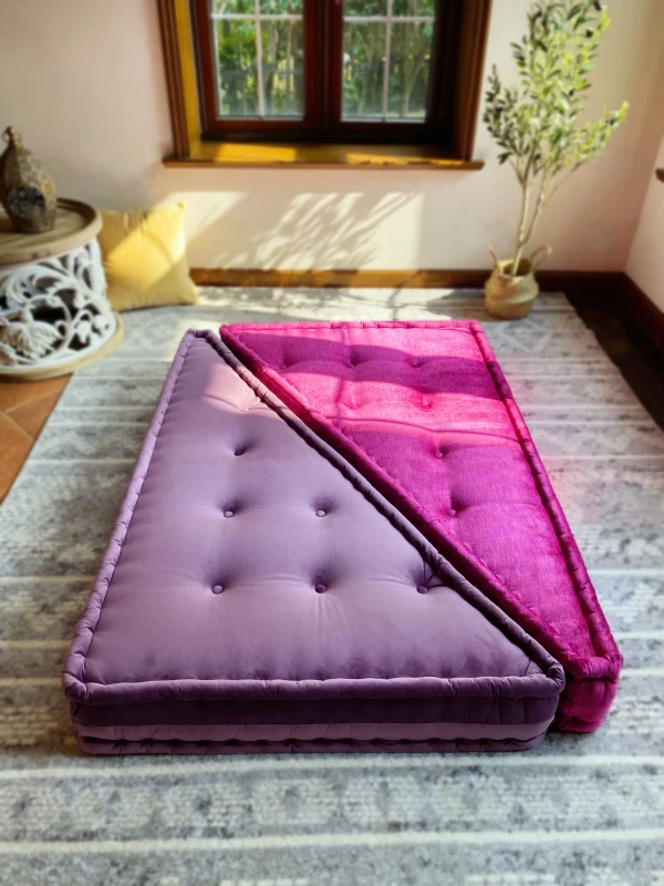 Top-down view of the Mah Jong sofa showcasing lavender and magenta cushions in a geometric arrangement.