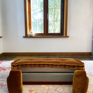 Rear view of the French daybed Mah Jong sofa with golden velvet upholstery, partially unfolded.