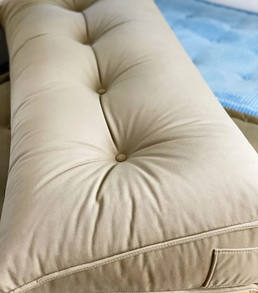 Close-up of the beige Mah Jong Daybed Sofa cushion with tufted detailing and soft fabric.