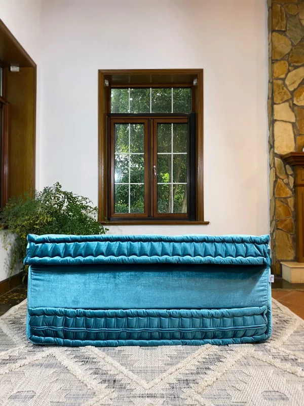 Rear perspective of the French Mah Jong daybed, highlighting its structured design and plush teal velvet upholstery.