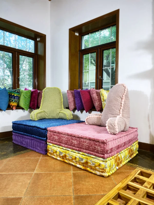 French daybed Mah Jong sofa with textured pink and purple bases complemented by matching cushions.