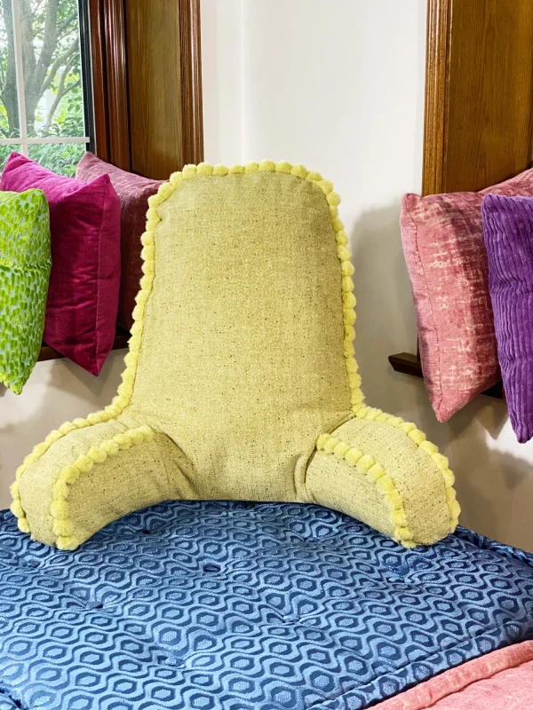 French daybed Mah Jong sofa styled near a window with colorful cushions and vibrant seating