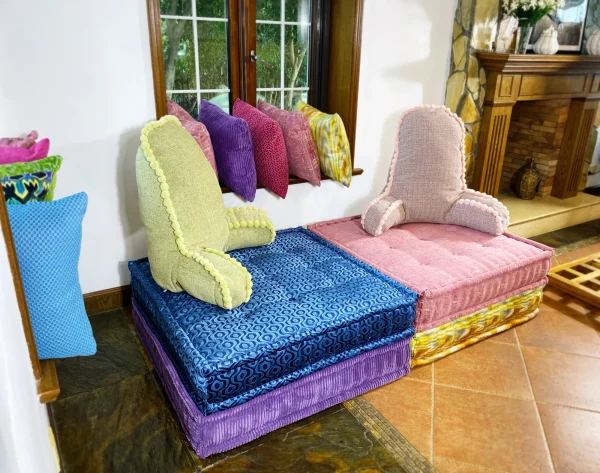 French daybed Mah Jong sofa with green and pink textured backrest cushions on vibrant blue and pink modular bases