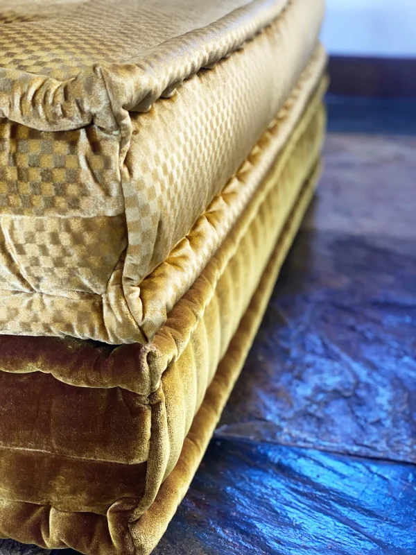 Close-up of golden velvet texture on the French daybed Mah Jong sofa, showcasing intricate craftsmanship.