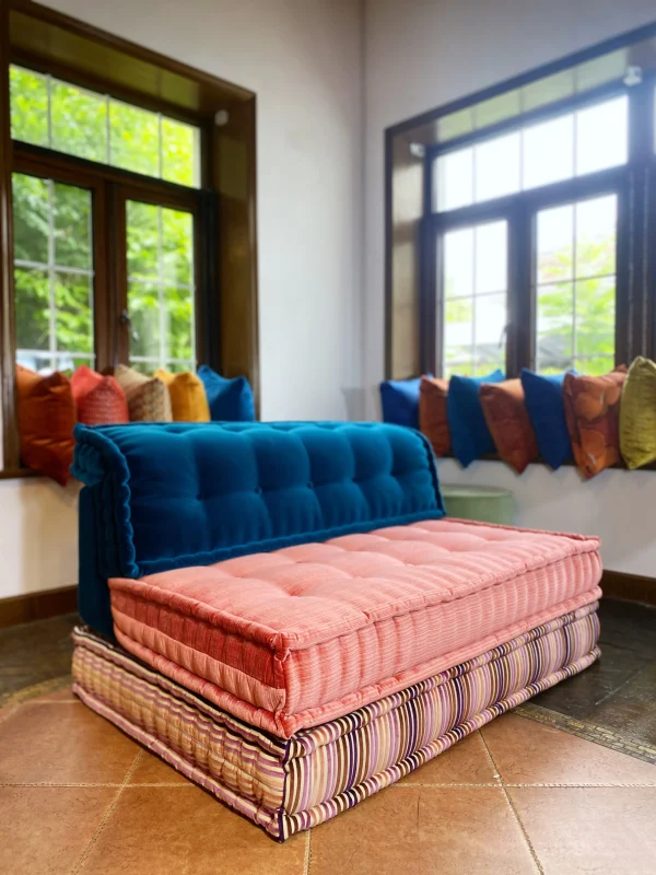 Frontal view of the Mah Jong modular sofa with blue, pink, and striped modules.