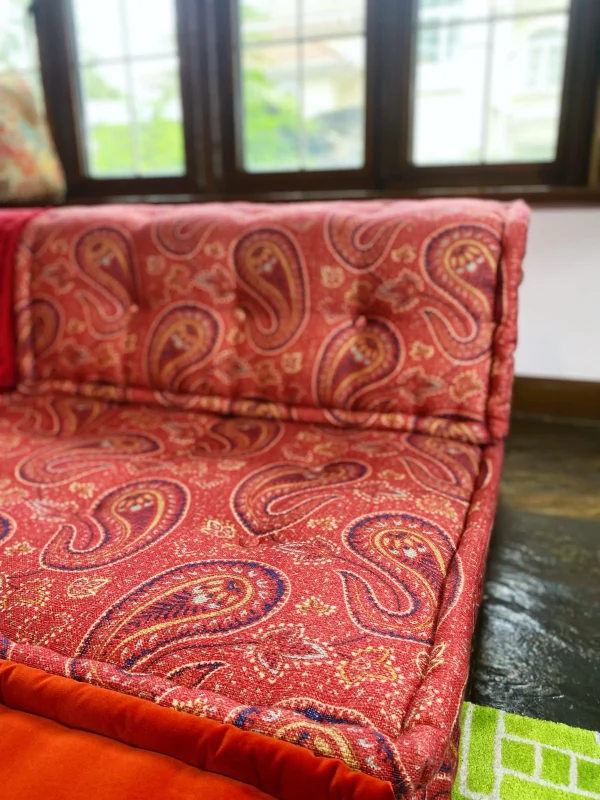 rench Mah Jong sofa featuring modular design with colorful fabrics including paisley, floral, and corduroy patterns.