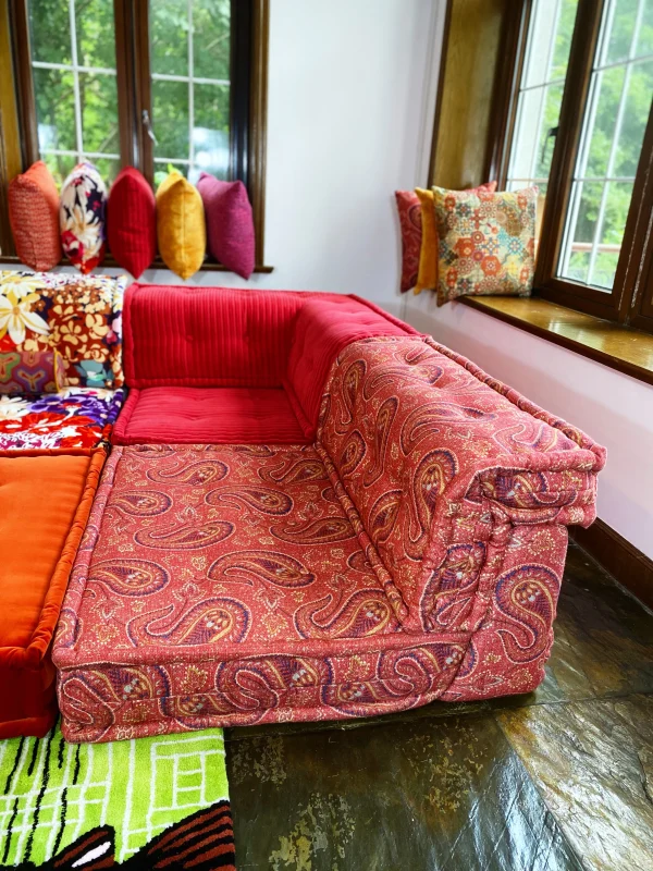 Modular sofa setup with French Mah Jong daybed featuring floral, paisley, and solid velvet upholstery.