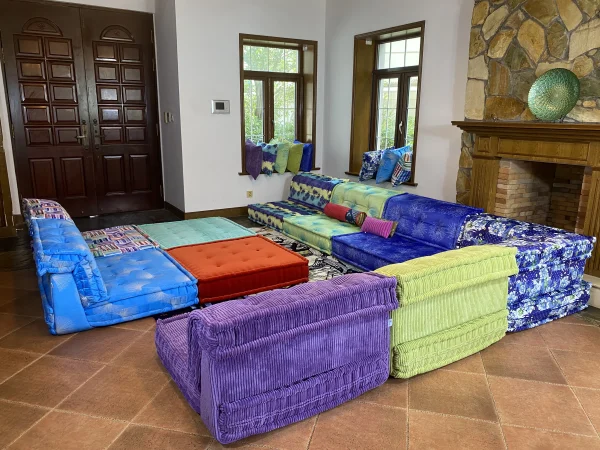 Modular Mah Jong sofa set arranged in a vibrant living room with diverse patterns.