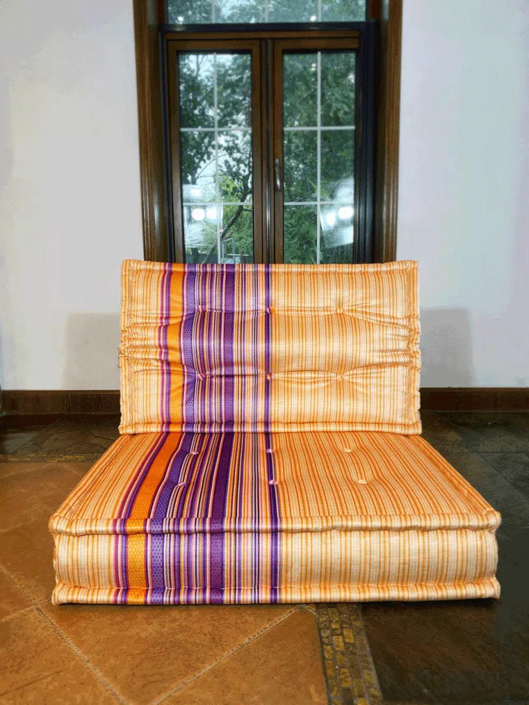 Mah Jong single seater in orange and purple stripes, with the purple band lined up across the seat and back