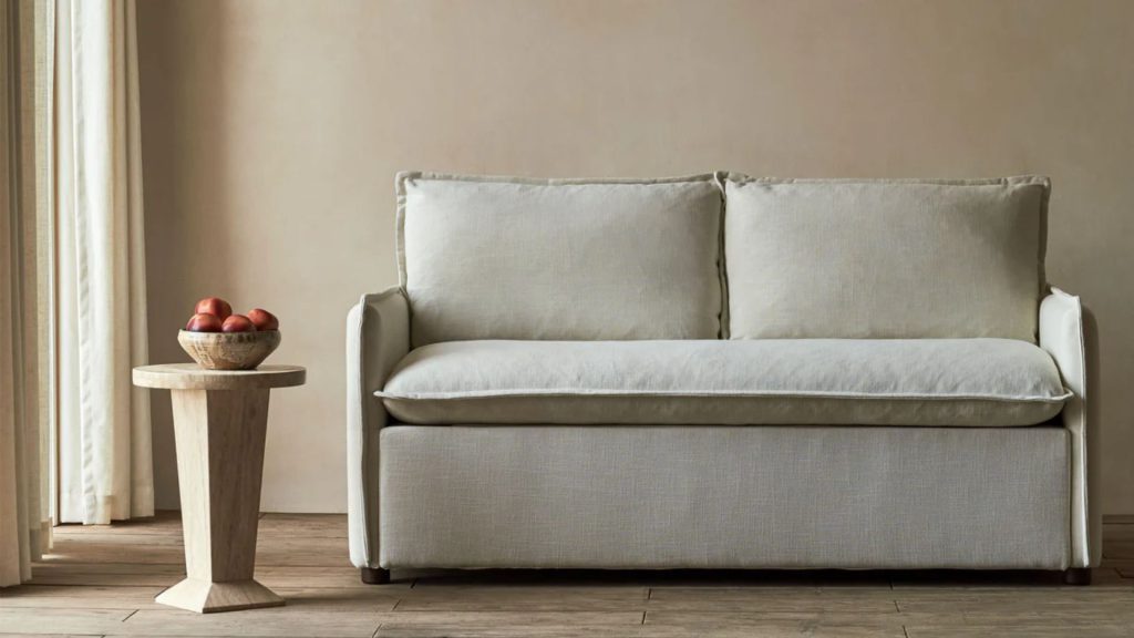 Sixpenny custom sofa with light neutral upholstery in a minimalist interior.