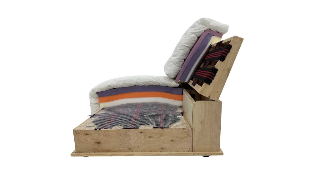 A sofa's inner construction showcasing the layers of the cushions and wooden frame.