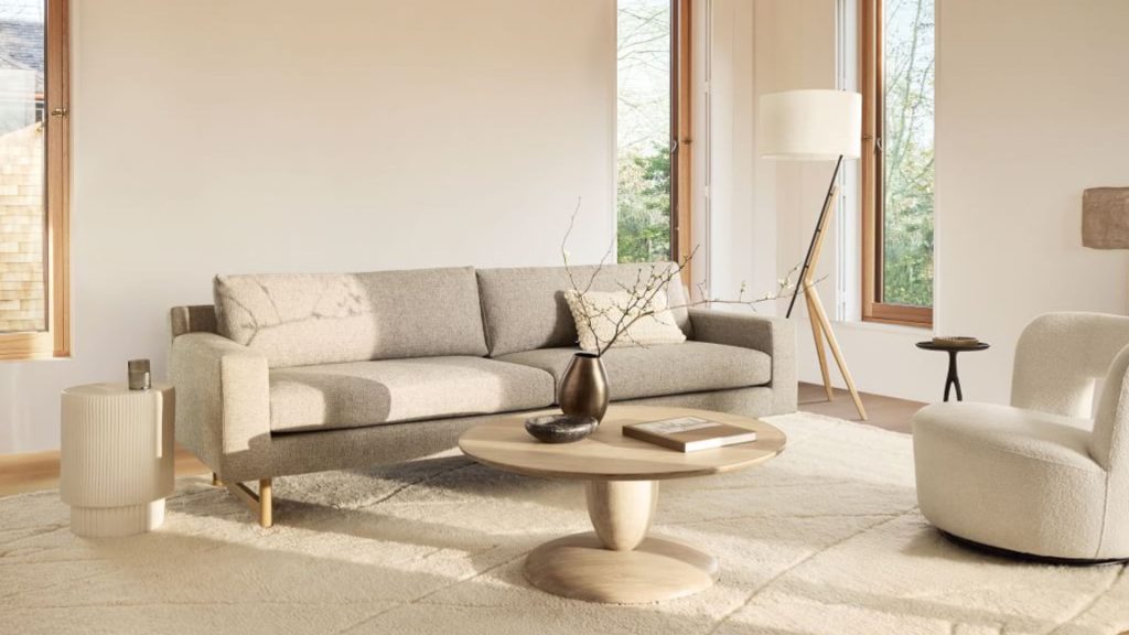 West Elm custom sofa in textured gray upholstery with tapered legs in a Scandinavian-inspired living room.
