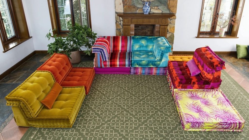 A colorful U-shaped sofa creating a bold focal point in a living room.