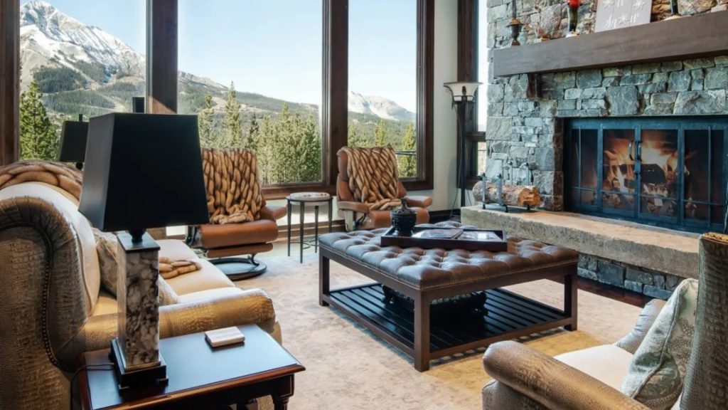 Sectional sofa centered on the fireplace as the main focal point of the living room.