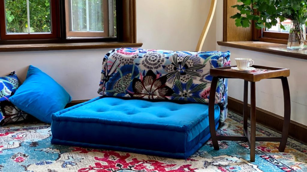 One-seater sofa paired with a coffee table as a flexible seating option.