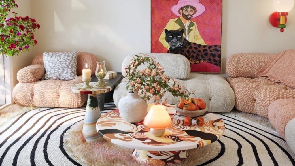Modern living room styled with white and pink Camaleonda sofas for a color contrast.