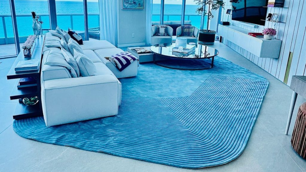 Adorn Croft's bespoke area rug in blue with an irregular shape for a client.