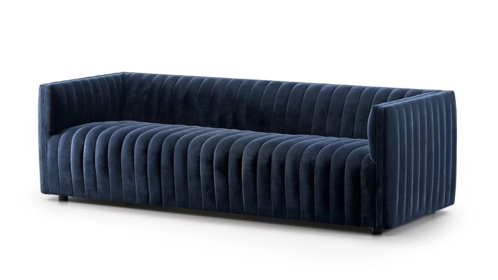 Anthropologie’s Alexander 88" Velvet Channeled Sofa with a white background.