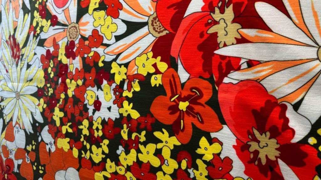 Closeup result of Adorn Croft's bespoke eclectic fabric with floral patterns.