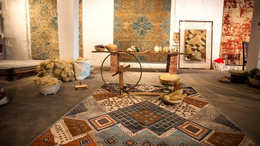 Jaipur's rug in a room with wall rugs in the backdrop.