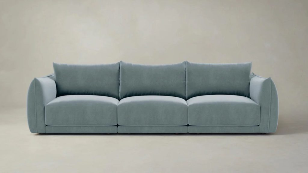 Maiden Home's Jones Modular Sofa upholstered with green fabric.