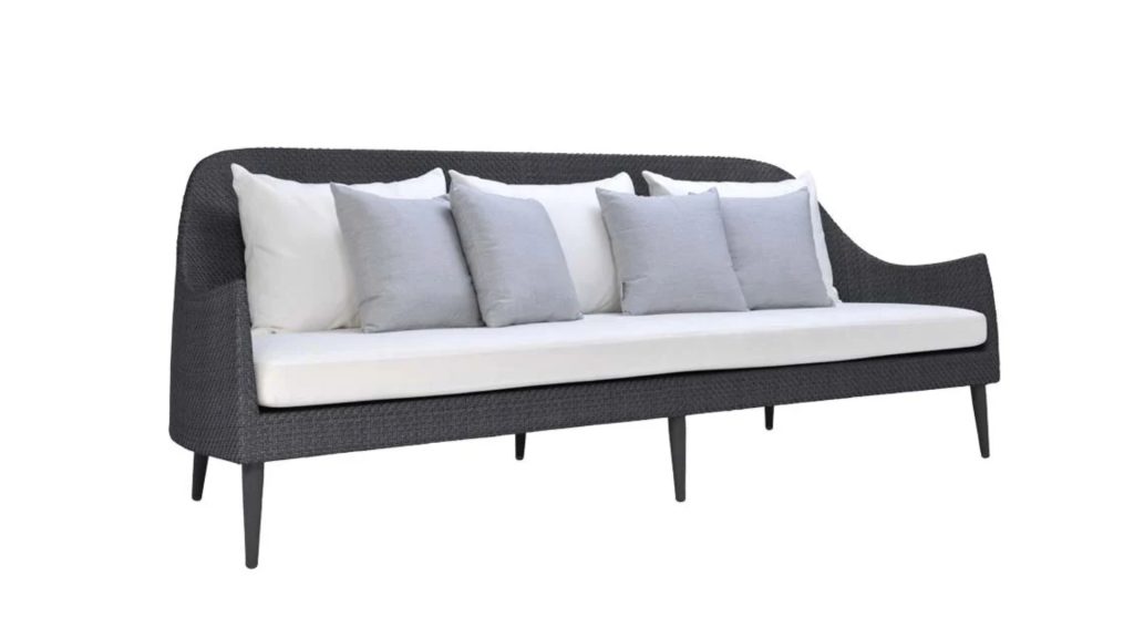 JANUS et Cie's Katachi Sofa with white upholstery and light grey pillows.