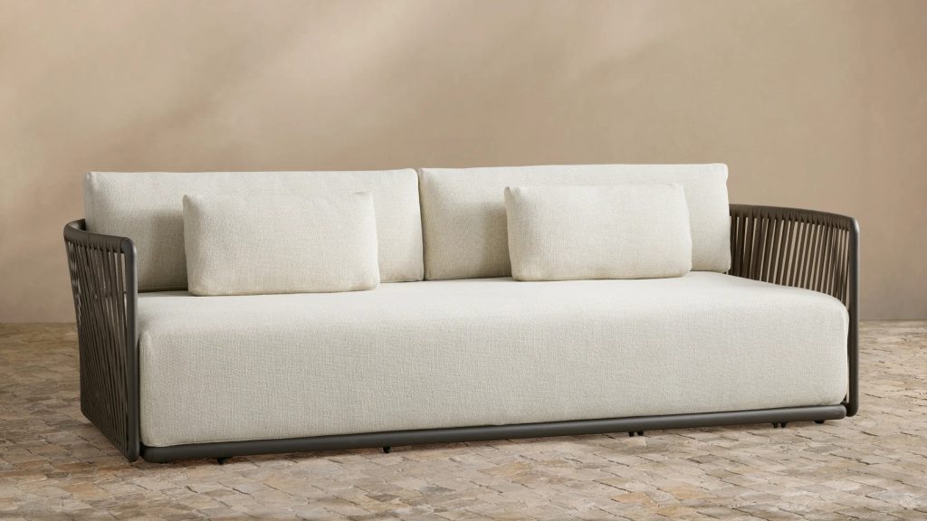 Arhaus' Lisbon Outdoor Sofa in an outdoor area.