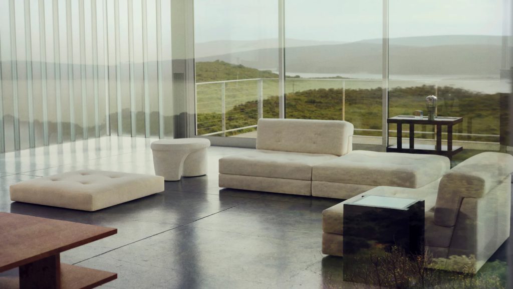 Maiden Home's sofa in cream fabric in a living space with an outdoor garden view.