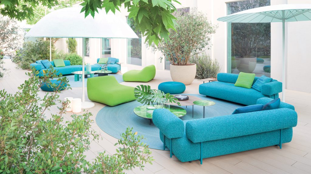 Paola Lenti's outdoor sofa set in vibrant teal and lime green fabrics.