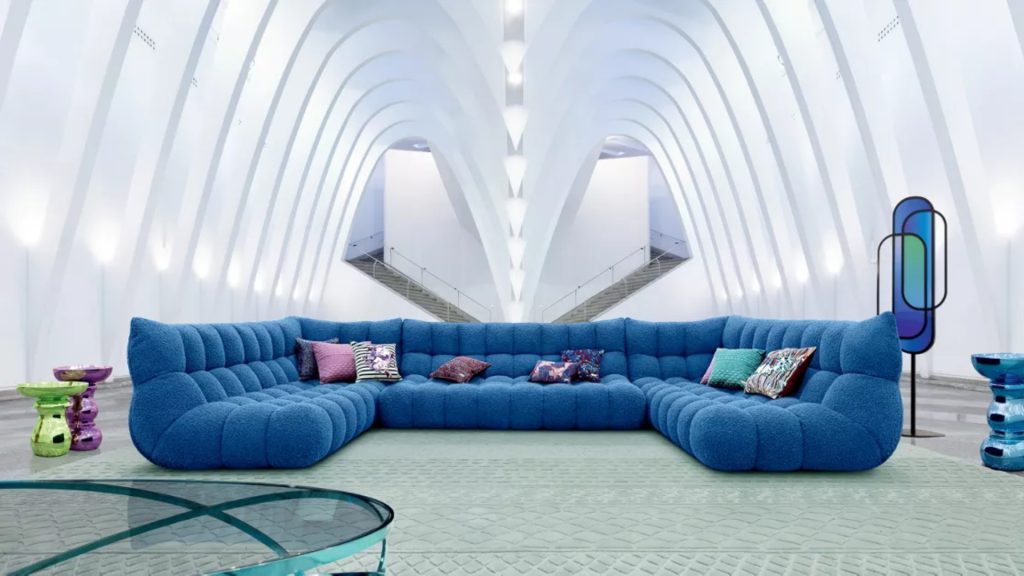 Roche Bobois' blue sectionals in a large, gallery-like space.