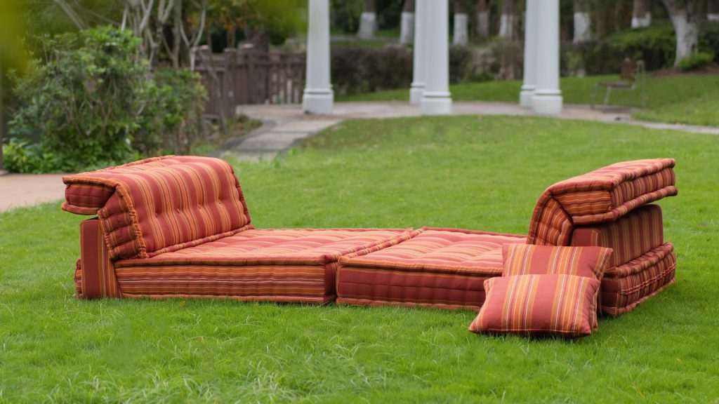 Adorn Croft's Rory Outdoor Colorful Sofa in a backyard.