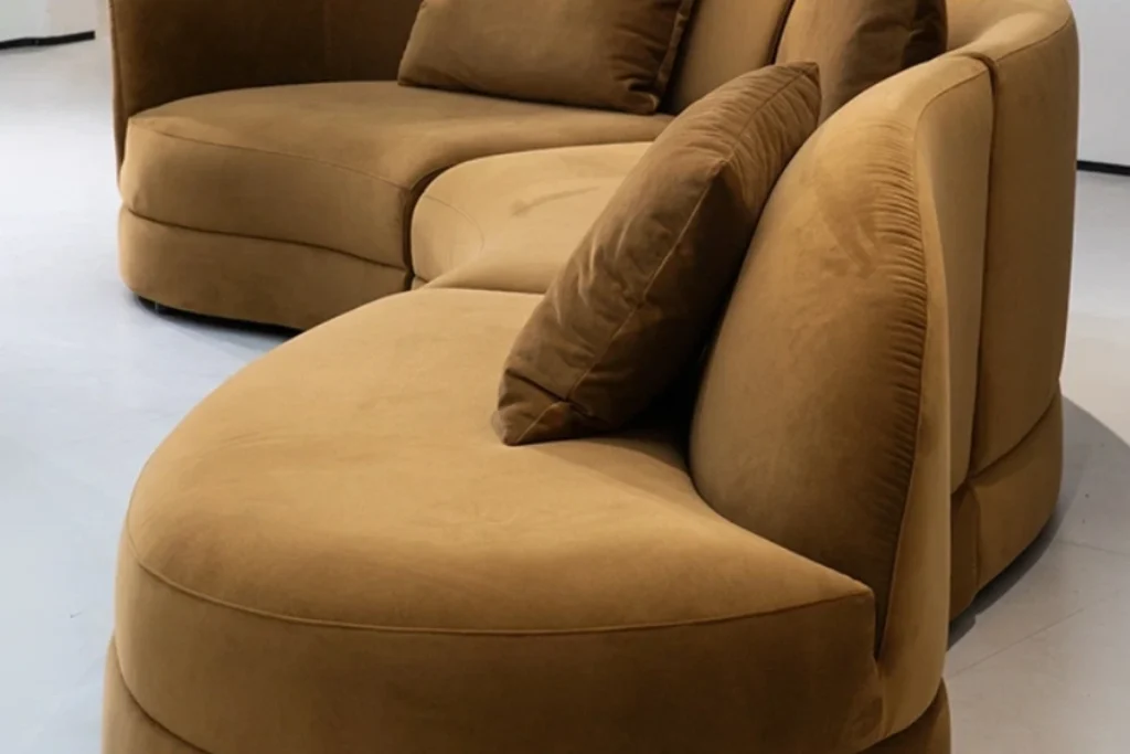The open end of the Doni curved sectional, where the back slopes away to leave room to stretch out