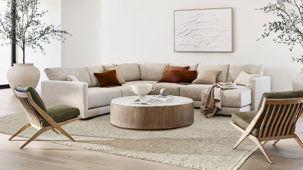 Crate & Barrel's custom sofa in light fabrics in a modern living room.