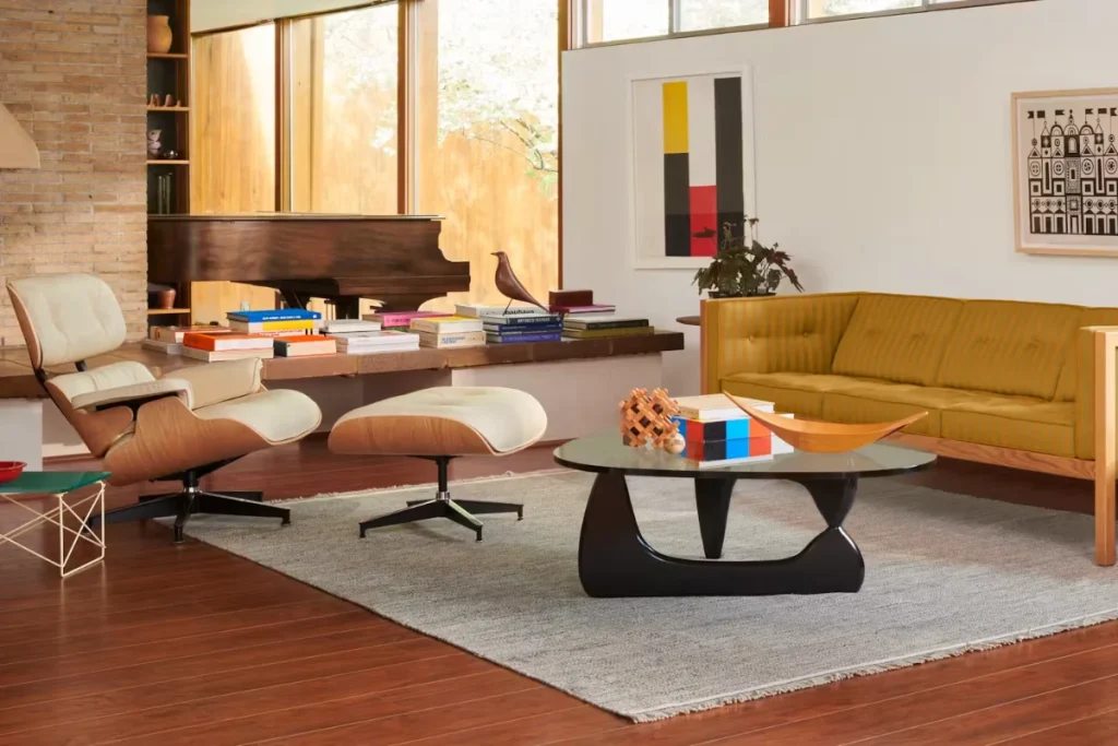 Herman Miller's Eames Lounge Chair and Ottoman beside an Eames sofa in a mid-century modern living room