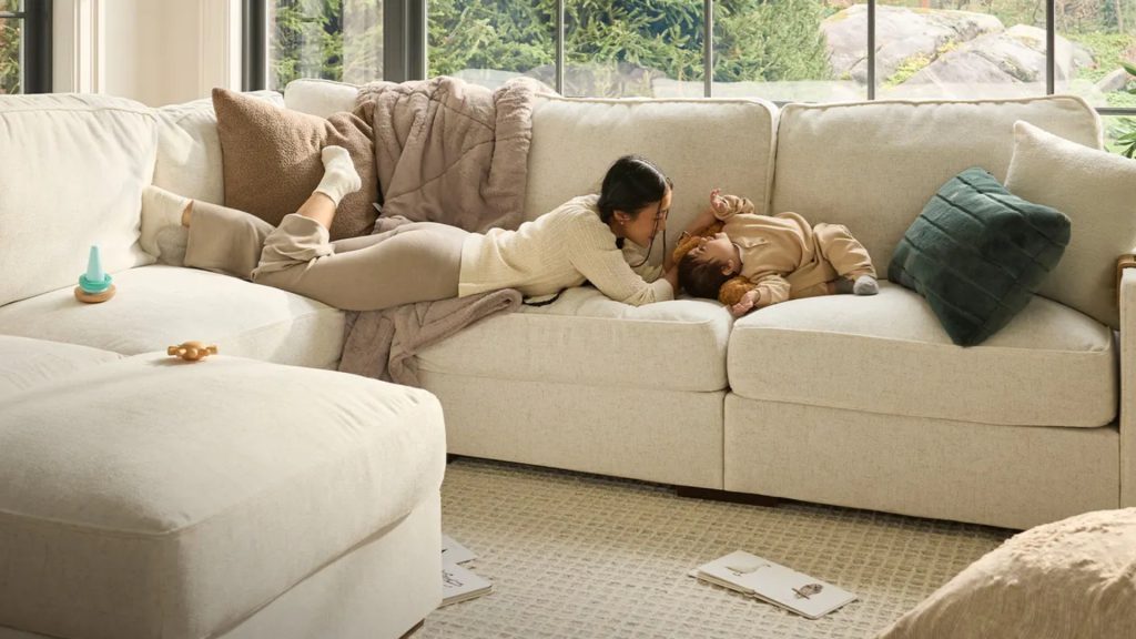 A mom and her child on Lovesac's Sactional sofa.
