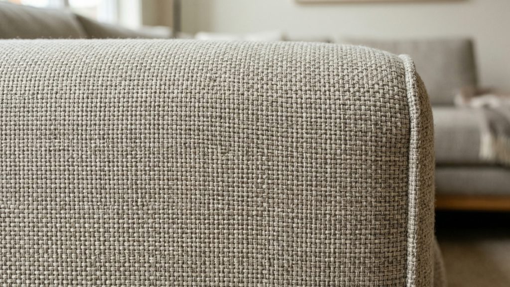 Closeup of a sofa with tightly-woven fabrics.