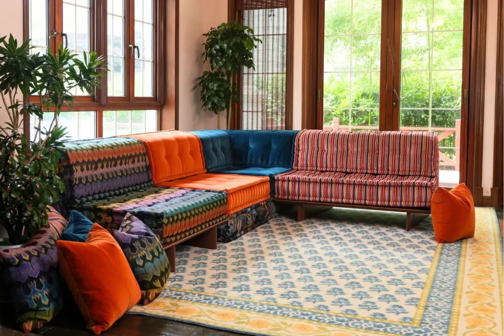 Fully bespoke colorful modular sofa with a raised wood base