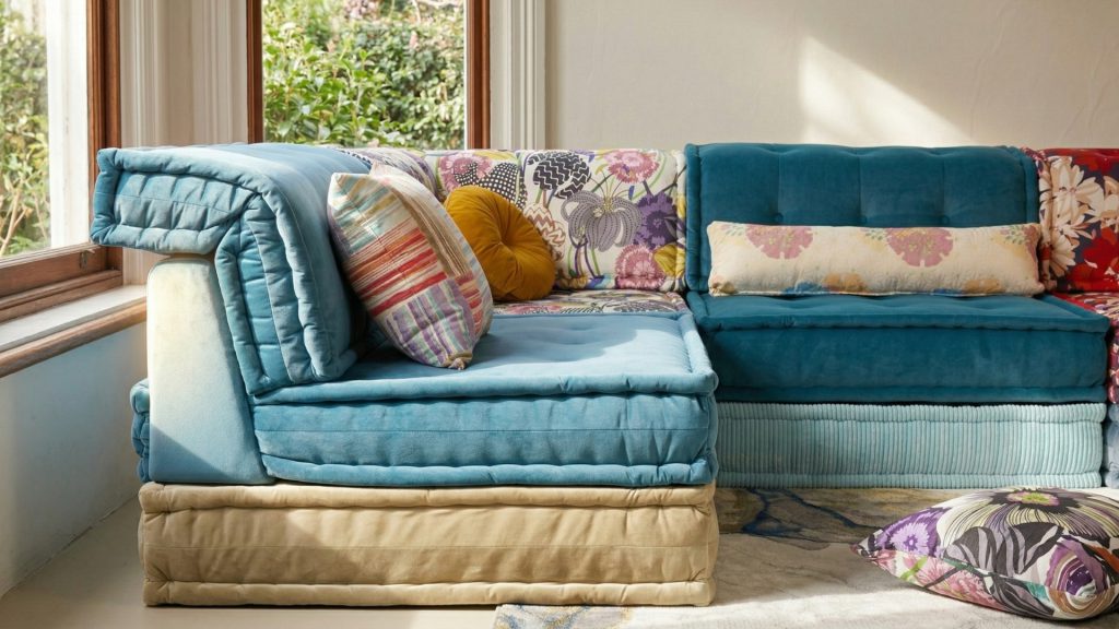 Sideways angle of Adorn Croft's colorful sofa, showing the backrest of one of its sections.
