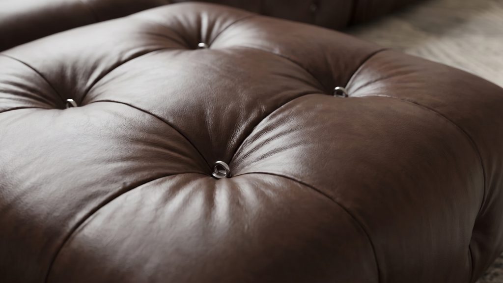 An espresso brown Mario Bellini ottoman.