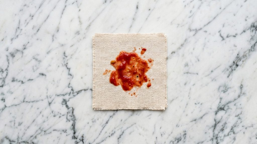 Ketchup stain on a cream sofa fabric