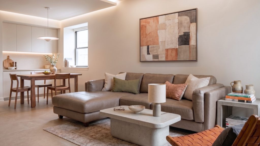 A grey sofa in a living room of a small flat