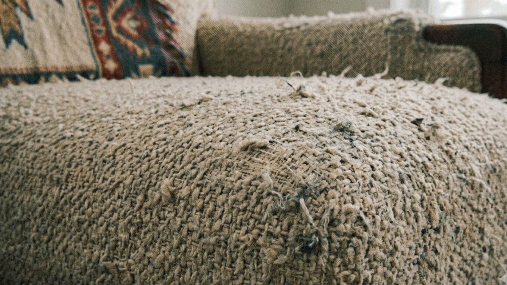 Worn out boucle sofa fabric